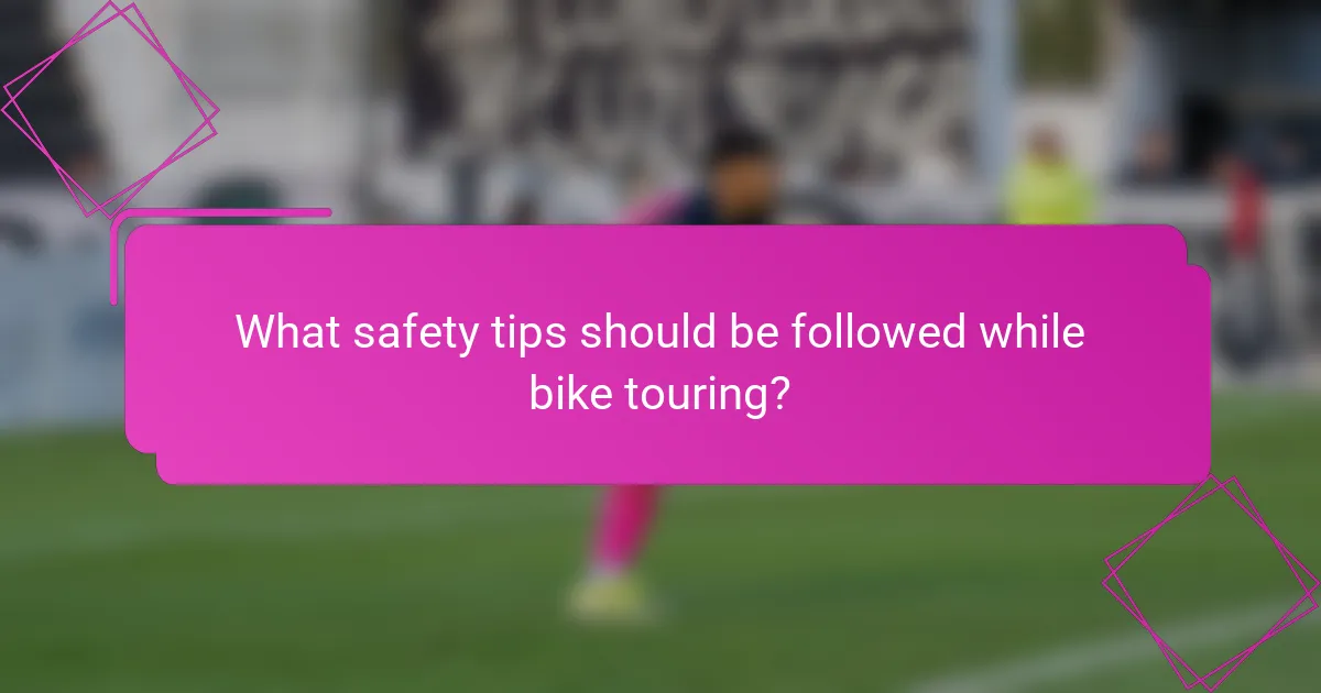 What safety tips should be followed while bike touring?
